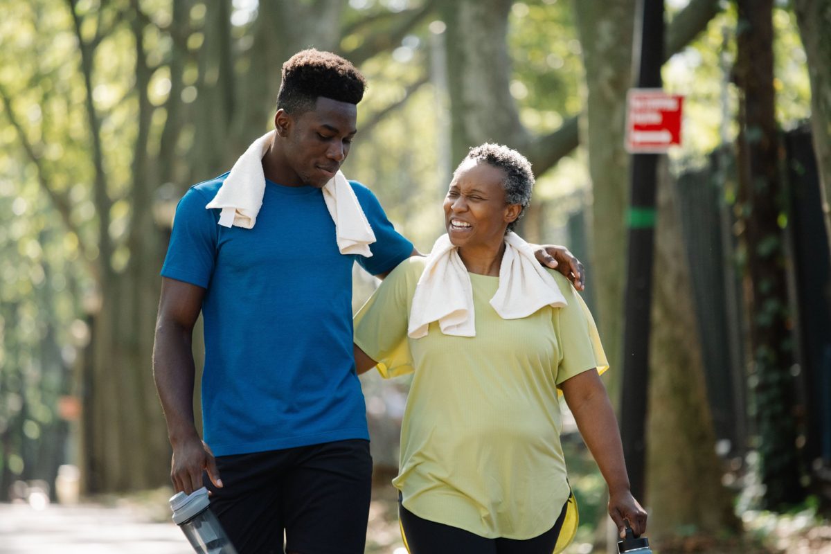 Two people walking together outdoors after exercise